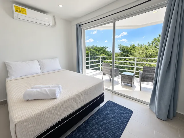 Air-conditioned bedroom with balcony access