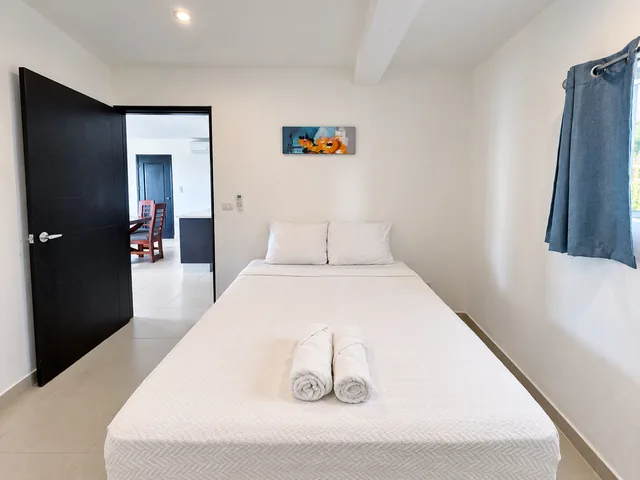 Guest bedroom with fresh linens and bedside space