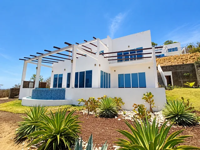 House exterior and shaded terraces