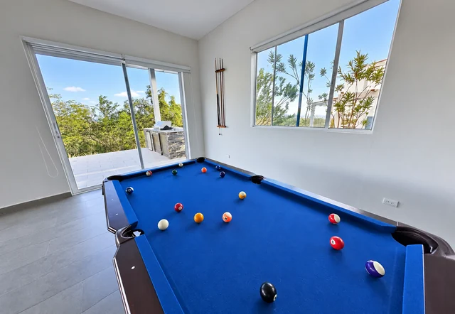 Pool table with views of the surrounding greenery