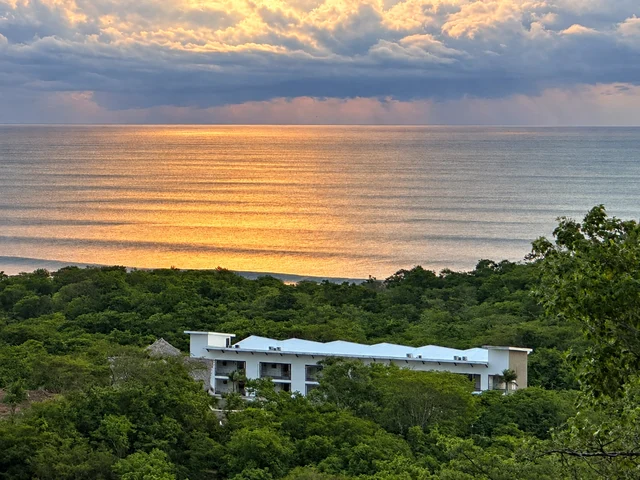 Sunset reflections over the ocean beyond the condos